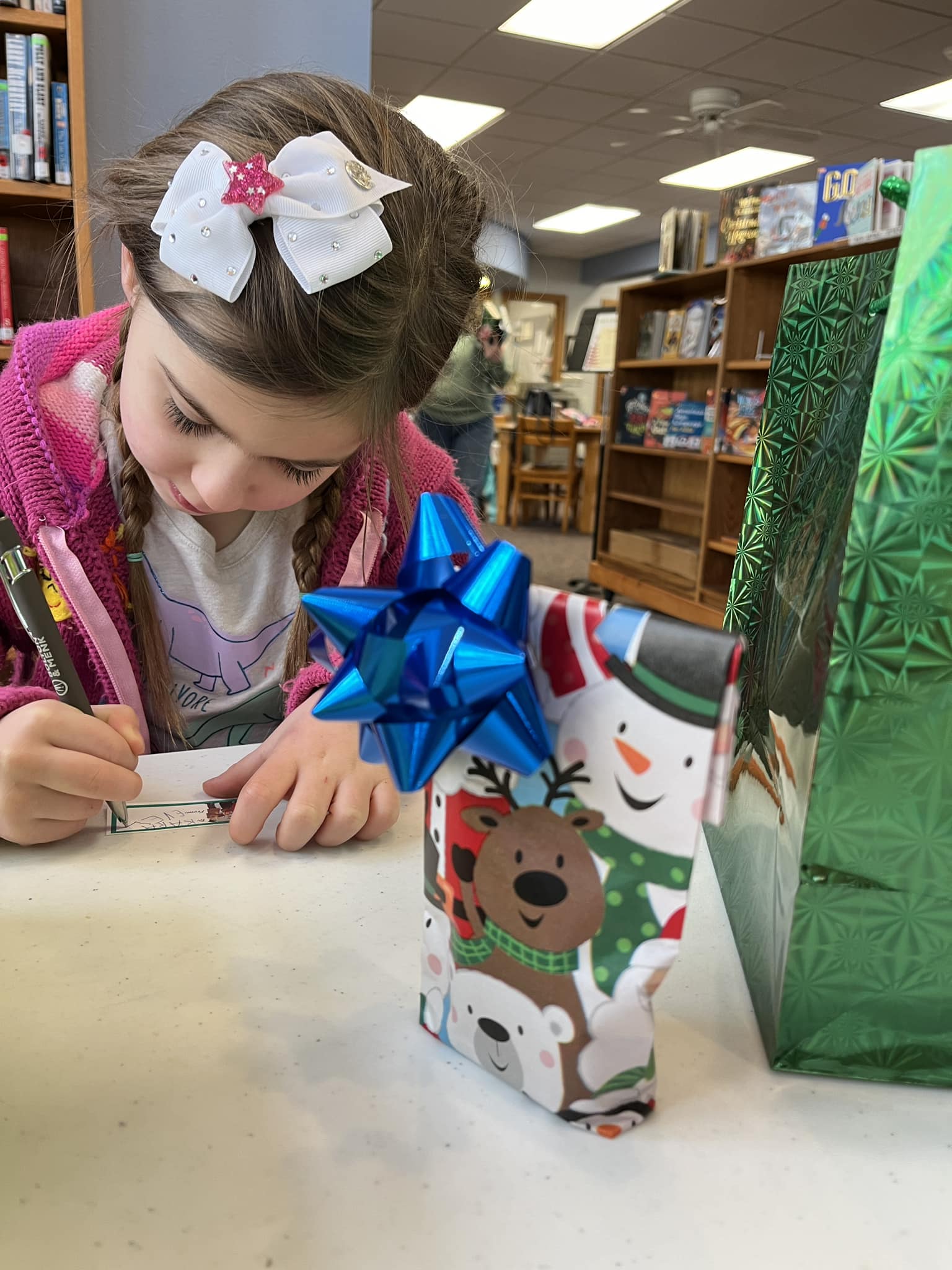 Child making holiday gift tag Child making holiday gift tag